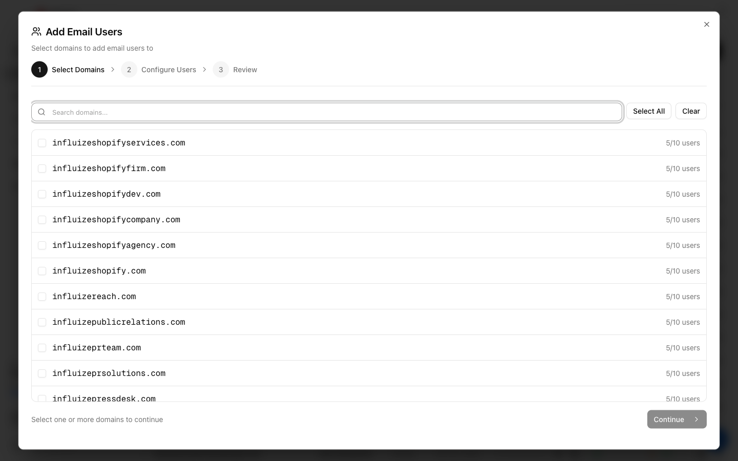 Add Email Users dialog listing domains with their current mailbox count out of the 10-per-domain cap
